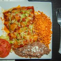 Birria enchilada · Corn tortilla, birria, cheese, sour cream, red salsa, green salsa, orange salsa, cilantro an...