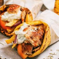 Halal Chicken Shawerma (Doner) Wrap · Thinly shaved halal chicken served with lettuce, tomatoes, parsley, onions, and tahini wrapp...