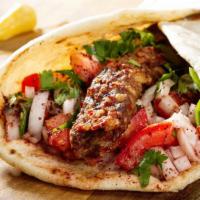 Halal Beef Shish Kabob Wrap · Beef sirloin on a skewer charbroiled then pulled onto lavash bread with lettuce, tomatoes, a...