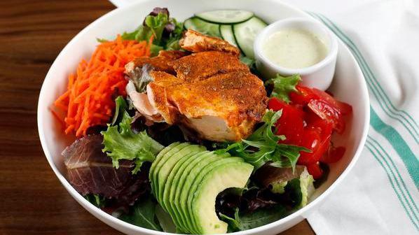Baked Salmon Green Goddess Salad · Gluten free. Baked salmon, avocado, cherry tomatoes, cucumbers, shredded carrots, mixed greens, baby kale and romaine with a creamy basil dressing.