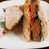 Turkey Meatloaf Sandwich · Indian-spiced turkey meatloaf with Peppadew peppers and arugula on toasted ciabatta.