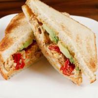 Deviled Egg Salad Sandwich · Deviled egg salad, bacon, avocado and Peppadew peppers on toasted thick- sliced white bread.