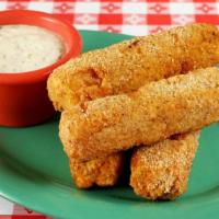 Fried Cheese Grits Stix · Cheesy grits, cornmeal coated and fried crisp on the outside and moist on the inside served ...