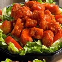 The Mayfair · Buffalo Chicken tenders served on a bed of lettuce with tomatoes.
