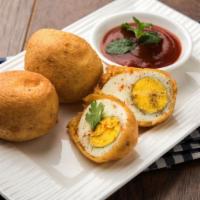 Egg Bajji · Deep fried Egg fritters tossed in gram flour