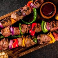 Lamb Seekh Kebabs · Ground lamb mixed with House Special Spices
