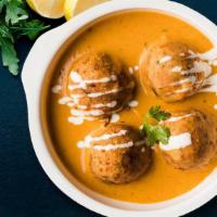 Vegetable Malai Kofta · Fried Vegetable dumplings cooked with Cashews
in tomato and onion creamy sauce