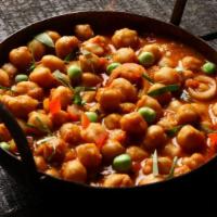 Chana Masala · Chick peas and Tomatoes cooked with fried garlic,
ginger, Onions and mixed spices
