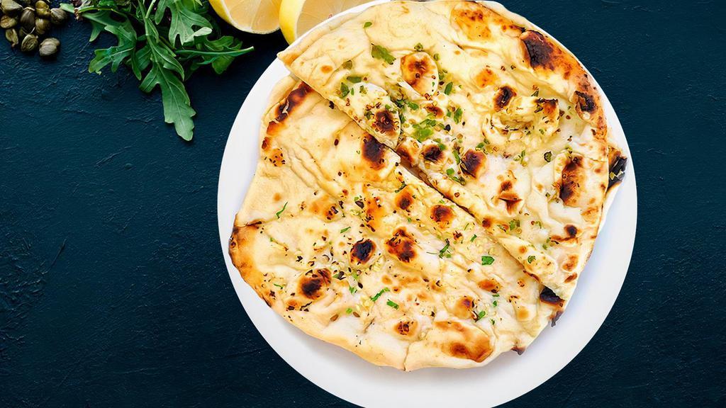 Butter Naan · A Indian bread made by oven-baked flatbread coated with fine butter.