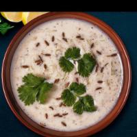 Raita (16 oz) · A simple authentic Raita an Indian yogurt sauce with cucumber, mint and cilantro.