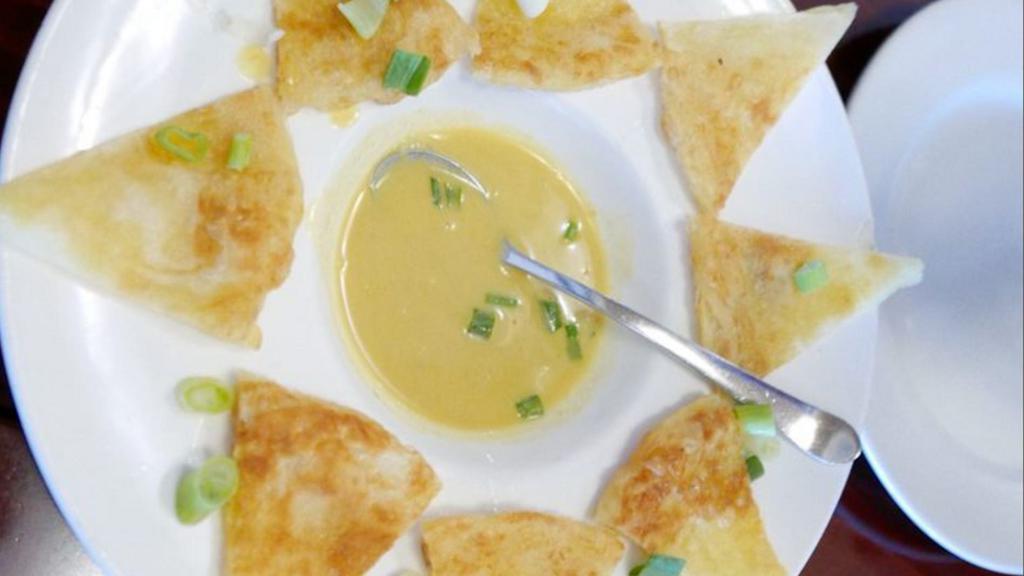 Roti · An Indian-style bread served with Thai yellow curry sauce