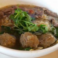 Thai Boat Noodles · Combination of slice beef, beef balls, spinach, bean sprout and noodles in beef broth.