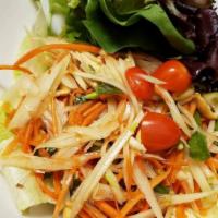 Som Tom Salad · Thai green papaya salad with crushed peanuts served with organic spring mix