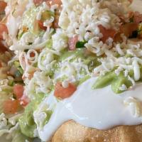 Chimichanga · Any meat, beans, guacamole, sour cream, cheese, lettuce, and salsa.
