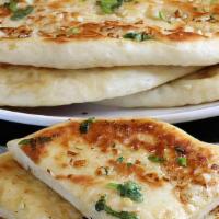Aloo Paratha · Stuffed with spices and potato.