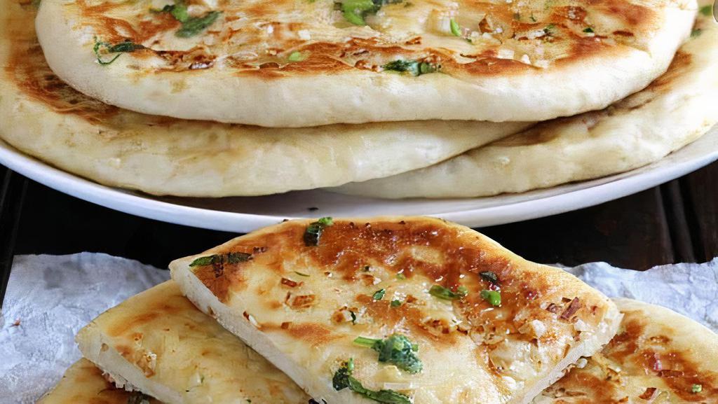 Aloo Paratha · Stuffed with spices and potato.