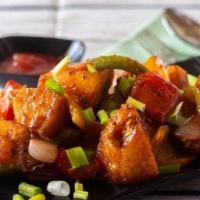 Chili Idli · Steamed rice cake cubes tossed in chili sauce topped with bell peppers, onions, spring onion...