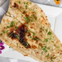 Butter Naan · Delicious while leavened bread baked in clay oven polished with Butter.