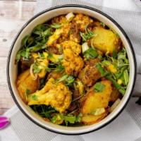Aloo Gobi · Fresh cauliflower with sautéed potatoes, stir fried with spices.