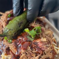 Loaded Potato · Butter, cheese, BBQ Beans, pulled pork, BBQ Sauce, Jalapeno, and green onions
