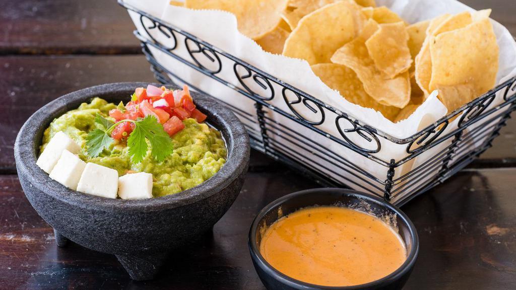 Guacamole y Chips · Vegetarian. Ripe avocado, onions, cilantro, serrano chile peppers, tomato, lime, queso fresco, and homemade tortilla chips. Add salsa, add crab & cucumber for an additional charge.