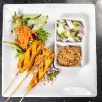 Chicken Satay · 3 skewers of chicken satay with peanut sauce and cucumber salad