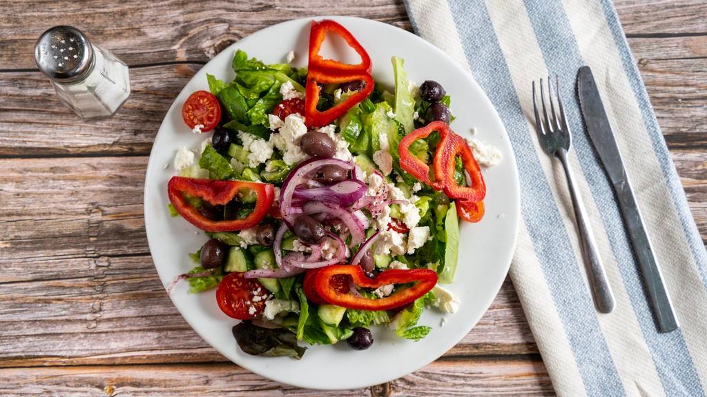 Greek Salad · Served with cherry tomatoes, cucumbers, red onions, olives, lettuce and feta cheese.