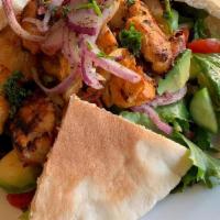 Chicken Kebab Wrap · Tender marinated chicken skewer charbroiled and served with the works.