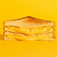 Grilled Cheese · Melted american and cheddar cheese on buttery toasted bread.