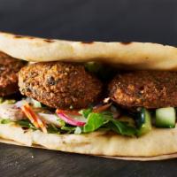 Falafel Wrap · Falafel with lettuce and tomatoes with our spacial sauce.