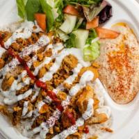 Chicken Doner Plate · Thinly sliced rotisserie style chicken, tomato, cucumber and red onion over greek rice, fren...