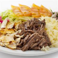 Koobideh Plate (Beef Kabob) · One skewer ground beef, served with tomatoes, onions, lettuce. and Taziki.