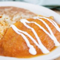 Spicy Chili Pasillas · A fresh chile pasilla filled with queso fresco, covered with egg batter and topped with juic...