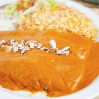 Enchiladas El Caminito · Two enchiladas filled with chicken breast, topped with melted cheese and el caminito sauce (...