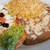 Chimichanga · Deep fried burrito (beef, chicken or pork) topped with chopped tomatoes, olives, sour cream,...