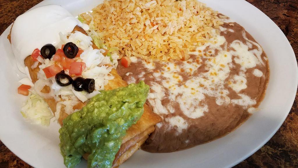Chimichanga · Deep fried burrito (beef, chicken or pork) topped with chopped tomatoes, olives, sour cream, guacamole, and melted cheese.