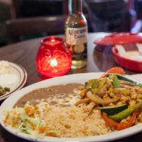 Fajitas · Cooked with onions, green peppers, zucchini, squash, and tomatoes. Served with cheese, guaca...