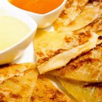 Roti · Pan fried Thai bread and served with curry and peanut sauce.