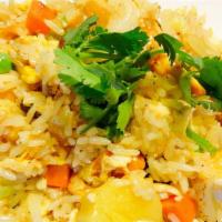 Pineapple Fried Rice · Stir fried rice, pineapple, raisin, cashew nut, egg, green pea, carrot, curry powder, yellow...