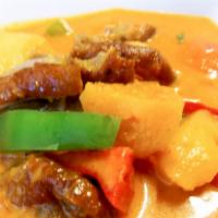 Duck Curry · Red curry paste with coconut milk, roasted duck, tomato, pineapple, bell pepper, basil.
