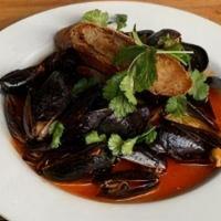 P.E.I Mussels · Yucatan broth, buttered Acme baguette  toast