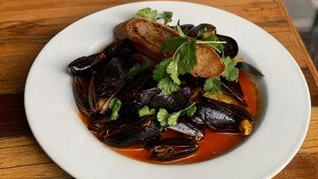 P.E.I Mussels · Yucatan broth, buttered Acme baguette  toast