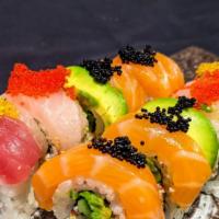 Rainbow · Crab & avocado topped w/ tuna, salmon, yellowtail, snapper