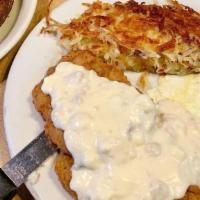 Country Fried Steak & Eggs Breakfast · Country fried steak, sausage gravy and two eggs any style. Served with dad's homemade hash b...