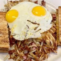 Meat Lover Hash Brown Blanket Breakfast · Bacon, sausage, ham, onions and cheese. Served with two eggs any style, dad's homemade hash ...
