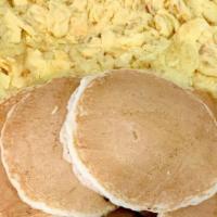 Classic Buttermilk Pancakes Breakfast · Two eggs any style and choice of meat.