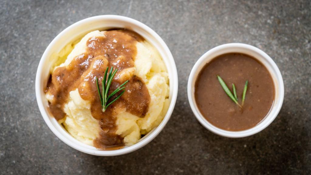 Mashed Potatoes & Gravy · Creamy & Buttery mashed potatoes, topped with brown gravy.
