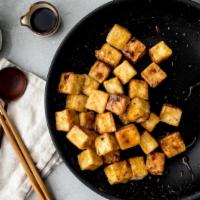 Crispy Tofu · Crispy tofu tossed in tangy chili sauce topped with crispy Thai basil leaves.
