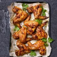 10 pc Bone-In Wings · Choose from 5 different flavours of peri peri. Comes with one peri peri sauce dip of your ch...