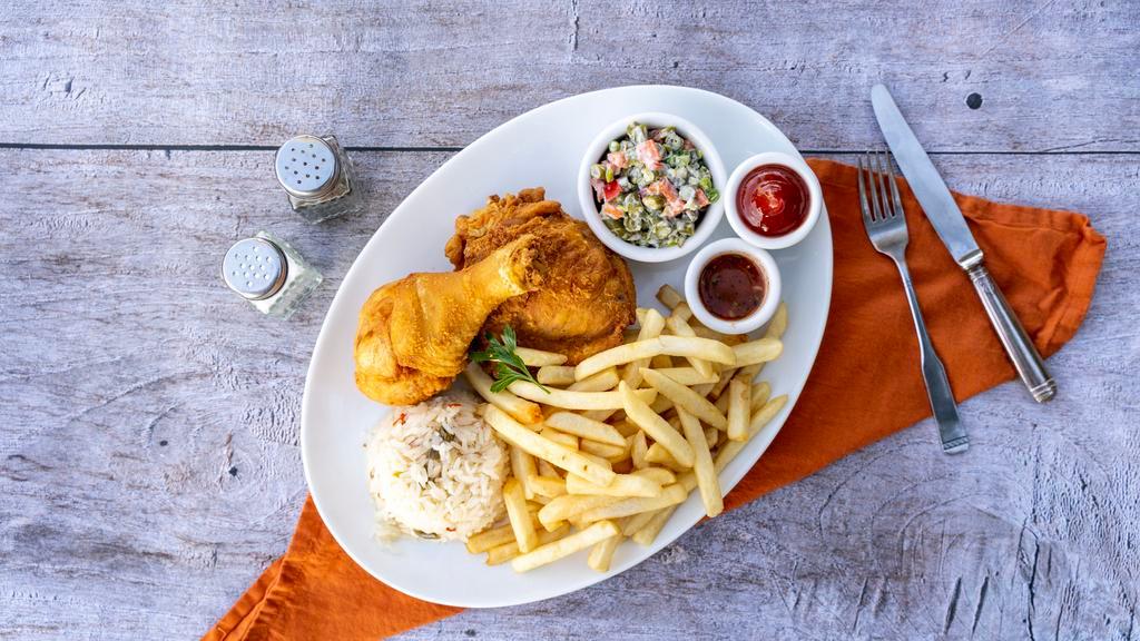 Pollo Rostizado · Fried chicken, rice, Russian salad and French fries.